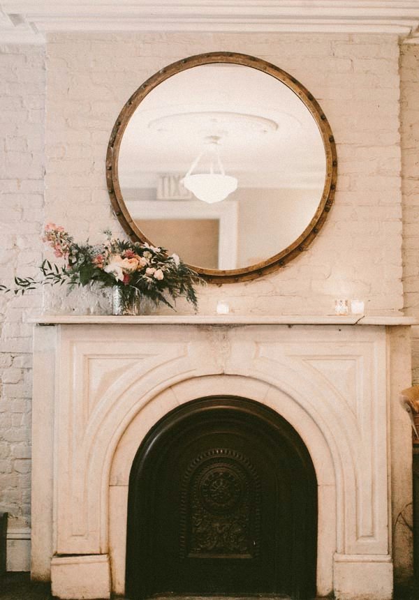 The mirrored fireplace at Maison May